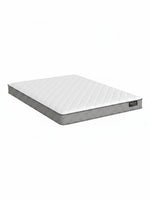 Matelas BackCare Solo de TOCO Meubles avec surface blanche matelassée et bordures grises, offrant un soutien ferme.