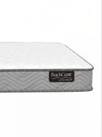 Matelas BackCare Solo par TOCO Meubles avec bordure grise texturée et étiquette de marque visible