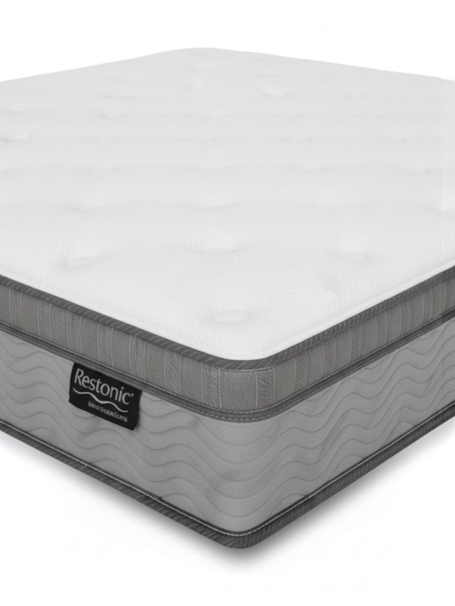 Matelas TOCO Meubles BackCare Trio très grand avec dessus coussinet, ressorts ensachés et bordure grise texturée.