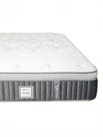 Matelas double TOCO Meubles Optima avec tissu matelassé blanc, bordures grises respirantes et ressorts ensachés.