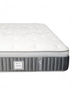 Matelas double TOCO Meubles Optima avec tissu matelassé blanc, bordures grises respirantes et ressorts ensachés.