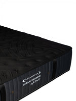 Matelas Dream Shadow HD de TOCO Meubles, réversible et ferme avec tissu tricoté noir et capitonnage latéral élégant.