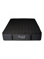Matelas réversible ferme Dream Shadow Grand de TOCO Meubles avec tissu tricoté noir et capitonnage latéral vertical.