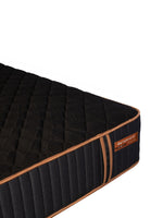 Matelas hybride ferme TOCO Meubles Cu Sleep XF noir avec détails cuivrés et coutures matelassées sur le côté