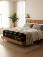 Matelas hybride TOCO Meubles Copper Sleep ET 14 pouces avec plateau Euro Top noir et détails cuivrés dans une chambre
