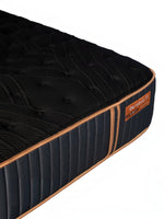 Matelas hybride TOCO Meubles Copper Sleep TT noir avec détails cuivrés et surface texturée sur fond blanc