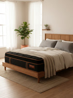 Matelas hybride TOCO Meubles Copper Sleep ET 14 pouces avec plateau Euro Top noir et détails cuivrés dans une chambre