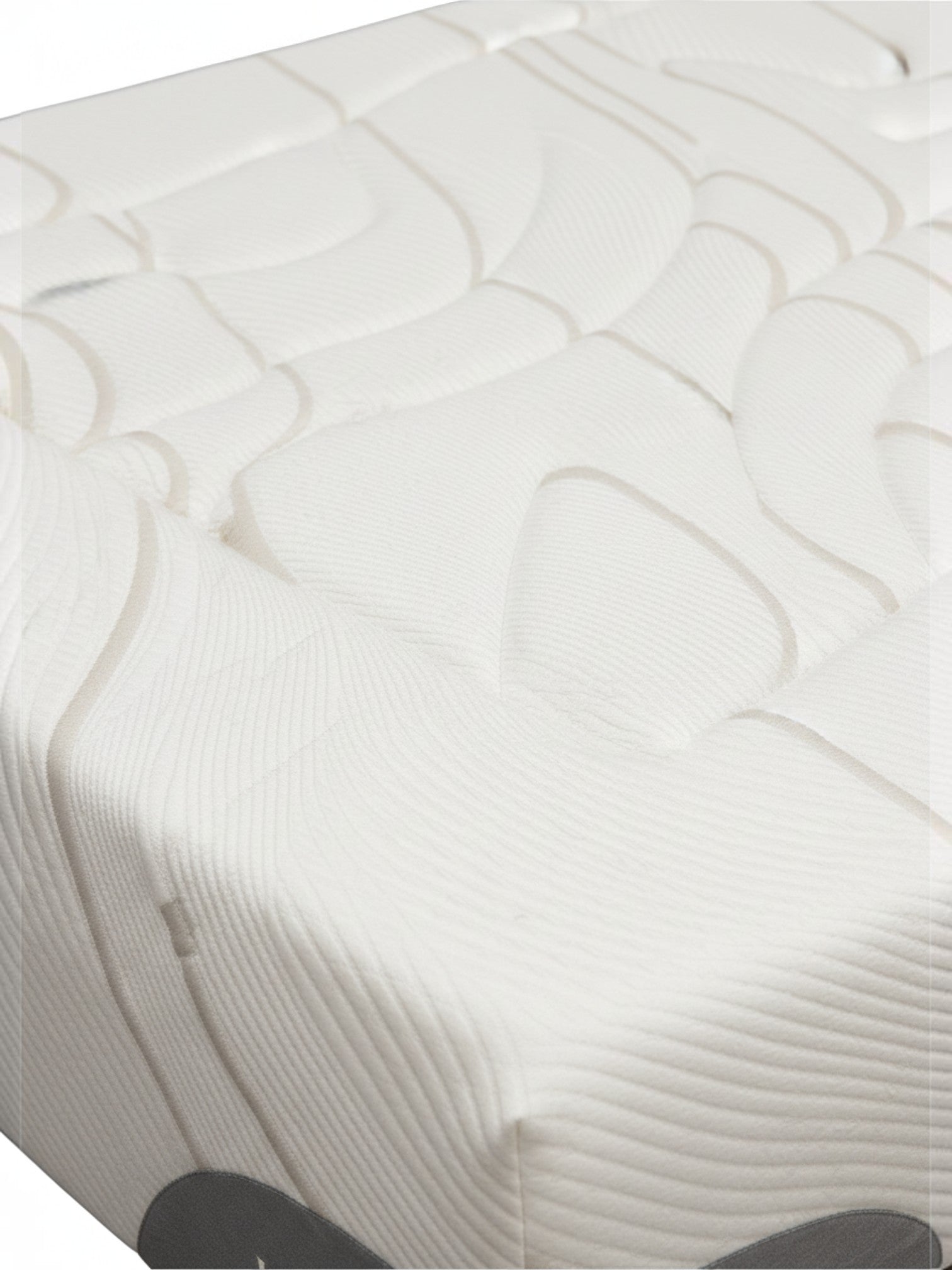 Gros plan sur le tissu blanc texturé du matelas Ultra Firm de TOCO Meubles avec motif ondulé et finition de luxe.