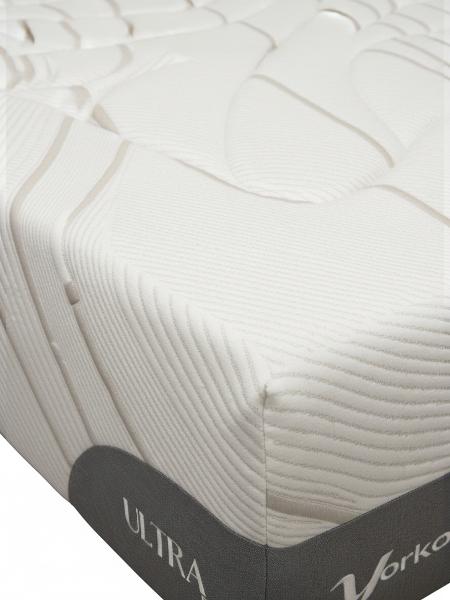 Matelas Ultra Firm de TOCO Meubles avec tissu blanc texturé et détails gris, offrant un soutien ferme et durable.
