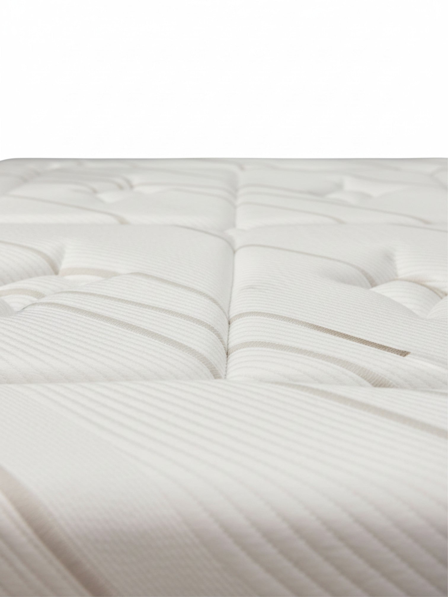 Gros plan sur la surface matelassée et le tissu rafraîchissant du matelas Ultra Plush de TOCO Meubles.