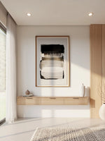 Meuble télé mural Lévio TOCO Meubles en bois clair avec trois tiroirs de rangement sous un tableau abstrait