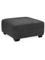 Ottoman surdimensionné Ambee de TOCO Meubles en tissu gris ardoise avec coutures apparentes et pieds noirs