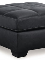 Ottoman surdimensionné TOCO Meubles en cuir noir avec surpiqûres contrastantes et pieds carrés robustes