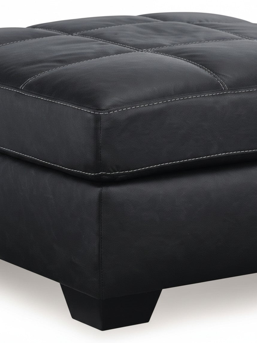 Ottoman surdimensionné TOCO Meubles en cuir noir avec surpiqûres contrastantes et pieds carrés robustes