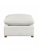 Ottoman Montrose de TOCO Meubles en tissu texturé beige clair avec pieds en bois, vue de face