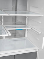 Intérieur du réfrigérateur MIDEA chez TOCO Meubles avec tablettes modulables Infinite Shelf et design spacieux