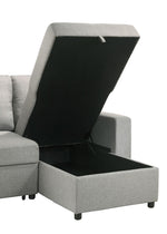 Sectionnel Fred gris de TOCO Meubles avec rangement intégré sous l'assise relevable. Tissu texturé.