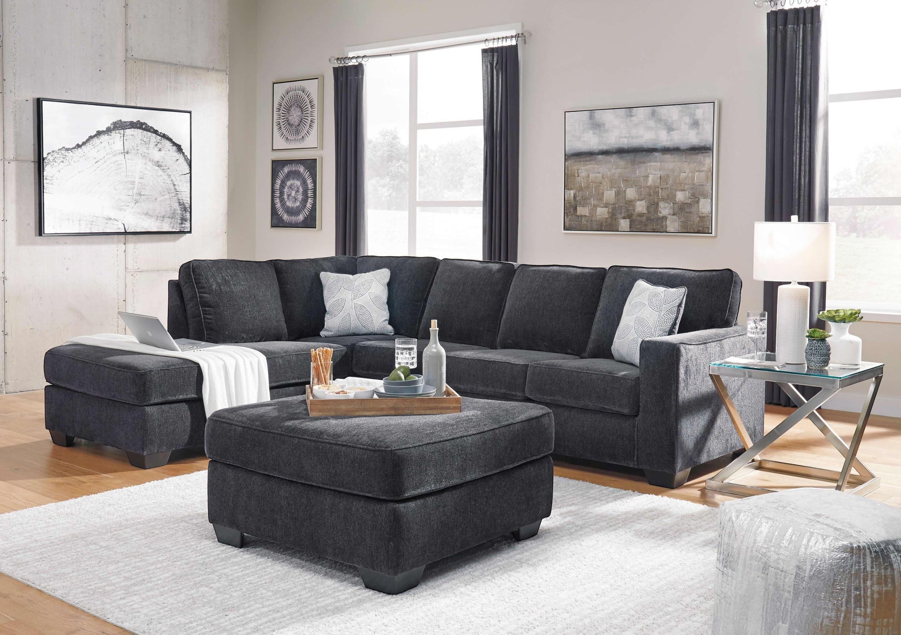 TOCO Meubles Sofa-lit sectionnel Marcel gris foncé en tissu, avec ottomans assortis et coussins décoratifs.