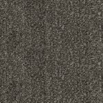 Gros plan sur le tissu gris texturé du sofa sectionnel Brutus de TOCO Meubles, montrant un tissage robuste.