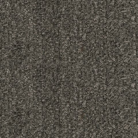 Gros plan sur le tissu gris texturé du sofa sectionnel Brutus de TOCO Meubles, montrant un tissage robuste.