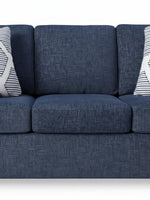 Sofa Evan bleu marine en tissu texturé avec coussins décoratifs à motifs géométriques par TOCO Meubles