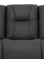 TOCO Meubles Sofa inclinable Elvis gris foncé avec surpiqûres contrastantes, assise confortable et dossier rembourré.