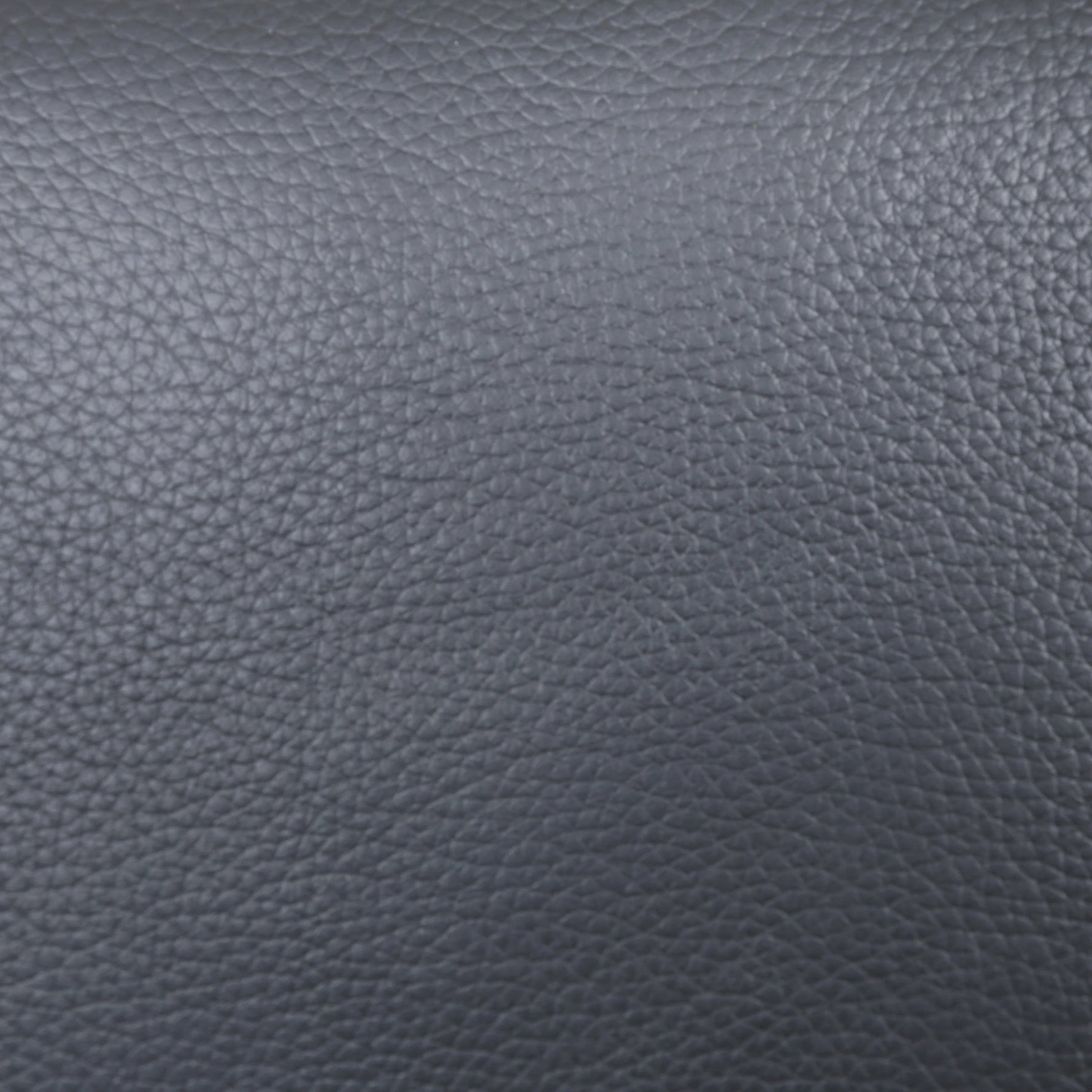 TOCO Meubles - Sofa inclinable Warren en cuir gris foncé, texture grainée, design moderne et confortable.