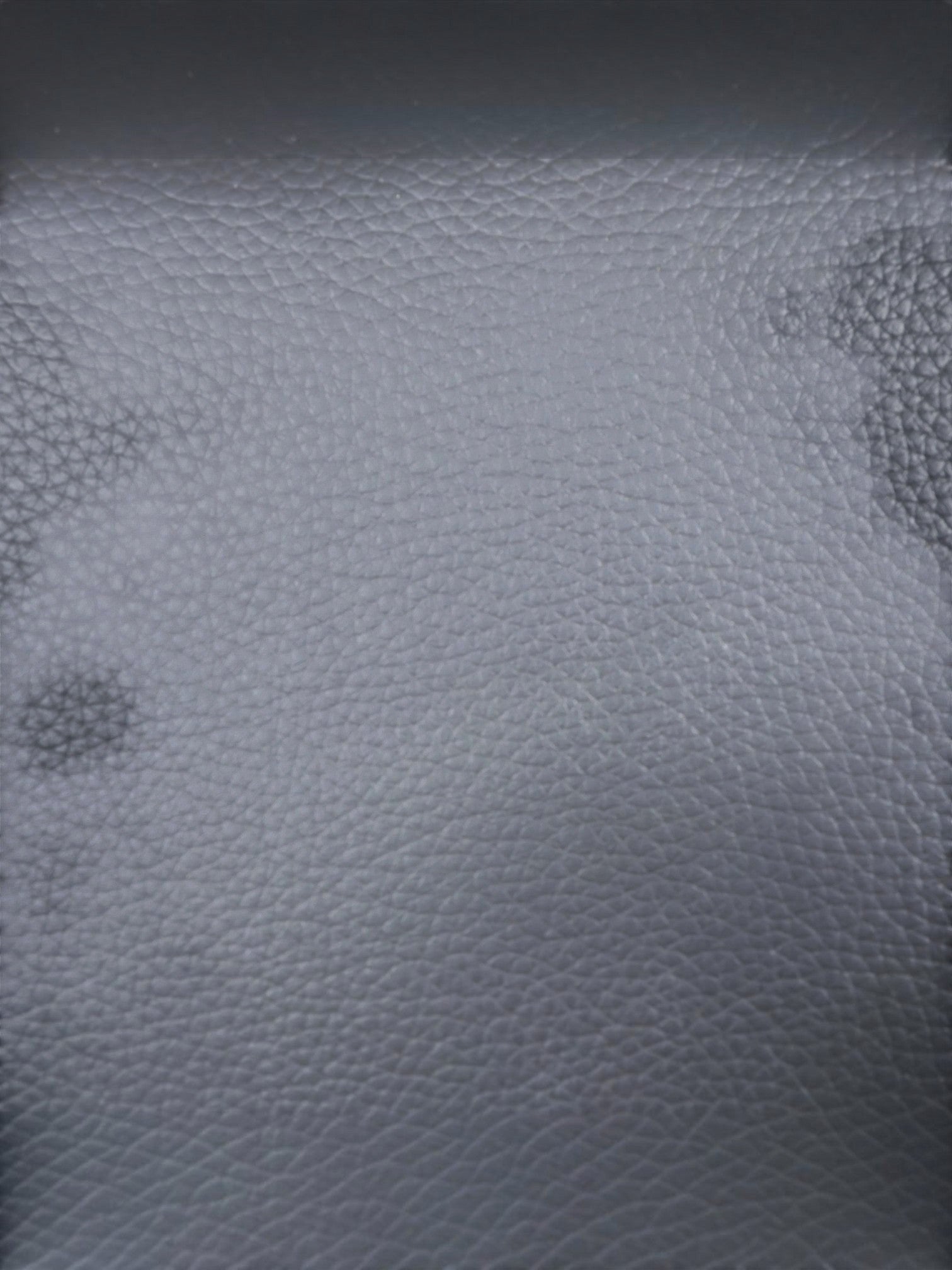 TOCO Meubles - Sofa inclinable Warren en cuir gris foncé, texture grainée, design moderne et confortable.