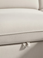 Gros plan sur le tissu beige texturé du sofa-lit sectionnel Terra de TOCO Meubles avec languette de tirage