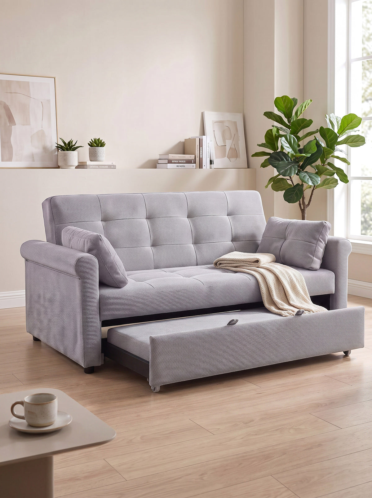 Sofa-lit Thomas de TOCO Meubles en tissu gris texturé avec tiroir gigogne et coussins assortis dans un salon moderne