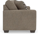 TOCO Meubles Sofa-lit Kaya taupe texturé avec coussins décoratifs géométriques marron et noir.