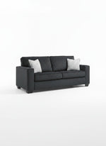 Sofa-lit Marcel gris foncé par TOCO Meubles avec deux coussins décoratifs clairs sur fond blanc