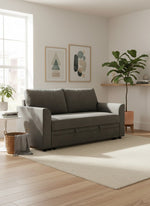 Sofa-lit Nico gris de TOCO Meubles dans un salon moderne et lumineux avec tapis beige et plante verte.
