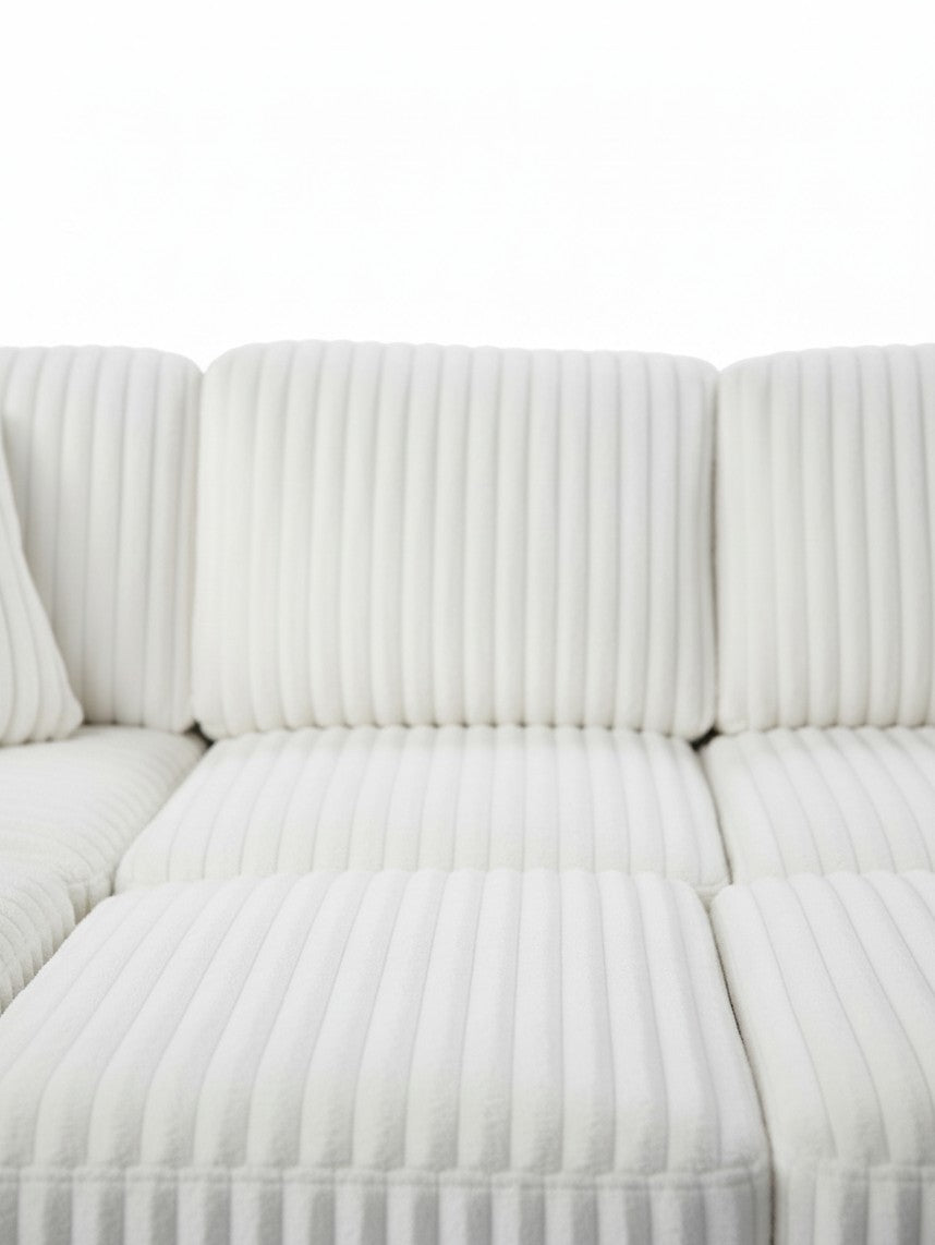 Sofa-lit sectionnel Célio blanc en velours côtelé texturé de TOCO Meubles