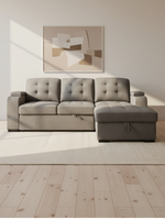 Sofa-lit sectionnel TOCO Meubles gris avec méridienne, dossier capitonné et rangement intégré dans un salon moderne.