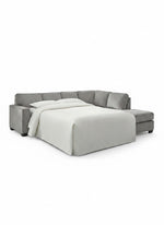 Sofa-lit sectionnel Marcel gris en tissu de TOCO Meubles avec lit déplié et couverture blanche