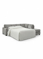 Sofa-lit sectionnel Marcel gris en tissu de TOCO Meubles avec lit déplié et couverture blanche