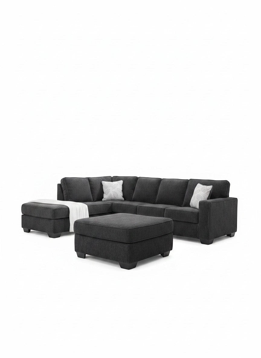 Sofa-lit sectionnel Marcel en tissu gris foncé avec pouf assorti, proposé par TOCO Meubles pour un salon moderne.