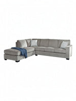 TOCO Meubles Sofa-lit sectionnel Marcel gris en tissu avec coussins décoratifs et jeté bleu.