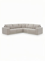 Sofa modulaire d'angle TOCO Meubles Soris en tissu beige clair avec design contemporain et coussins assortis