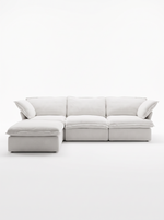 Sofa modulaire blanc Luna de TOCO Meubles avec trois sections et un ottoman assorti sur fond blanc