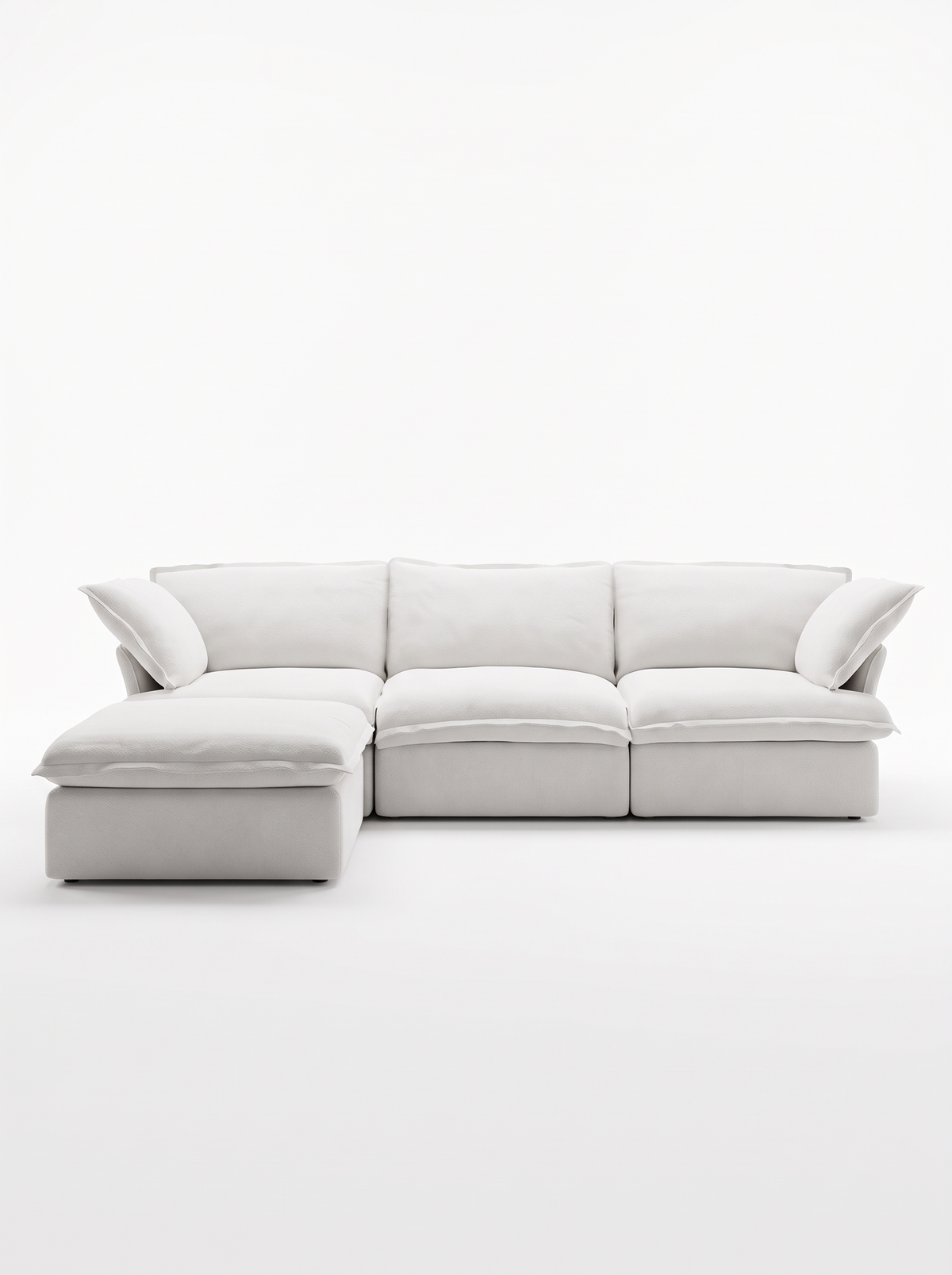 Sofa modulaire blanc Luna de TOCO Meubles avec trois sections et un ottoman assorti sur fond blanc