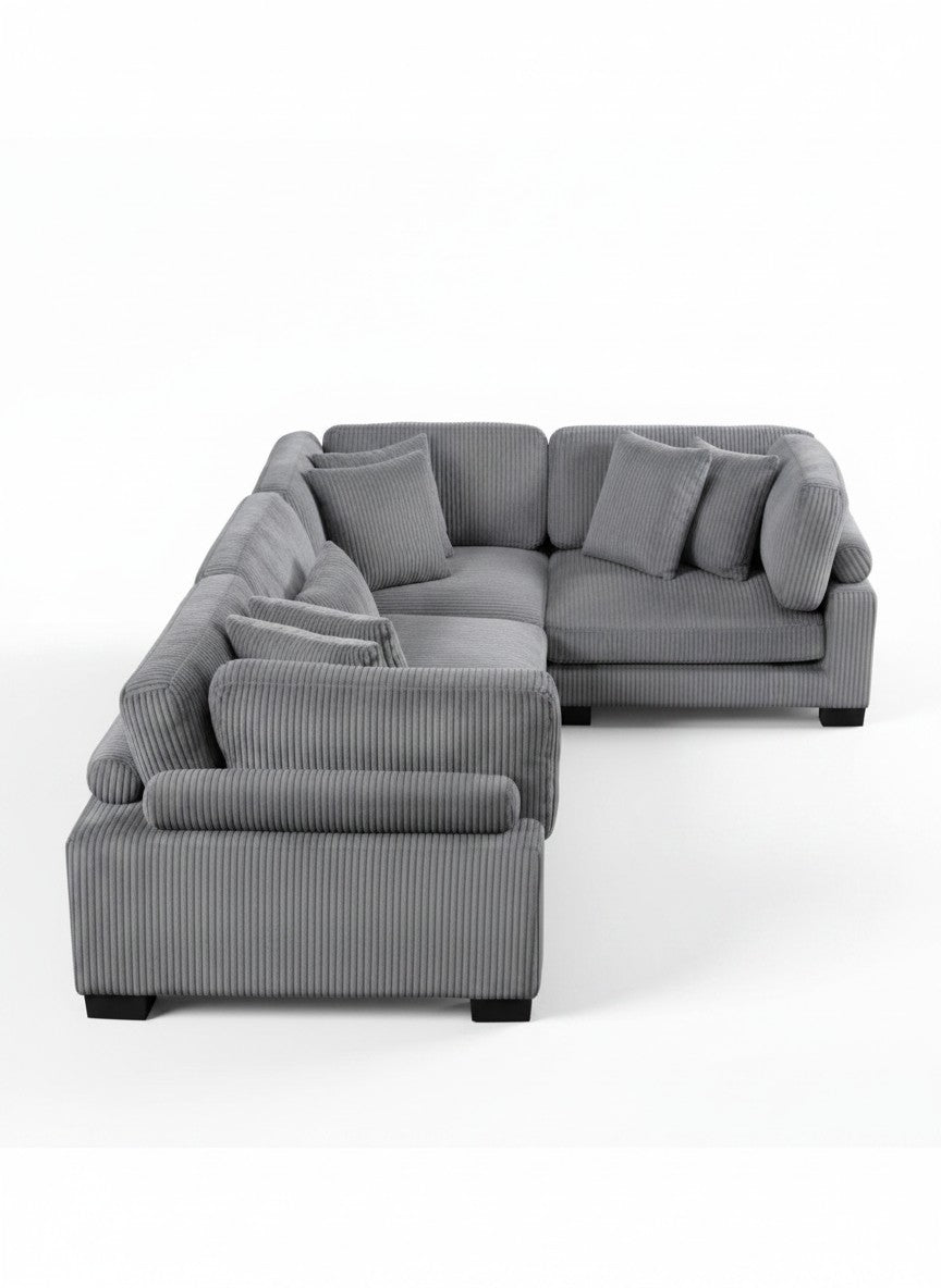 Sofa modulaire Traverse TOCO Meubles en velours côtelé gris avec assises généreuses et coussins décoratifs