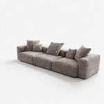 Sofa modulaire Nola de TOCO Meubles en velours côtelé gris avec trois sections et coussins décoratifs assortis