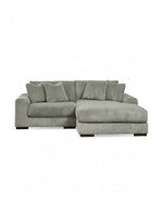 Sofa modulaire Manoa de TOCO Meubles en tissu velours côtelé gris avec méridienne et coussins assortis