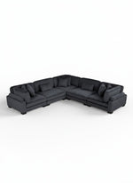 Sofa modulaire d'angle noir en velours côtelé de TOCO Meubles avec coussins décoratifs sur fond blanc