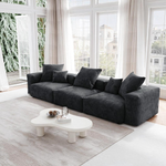 Sofa modulaire Nola 3 morceaux en velours côtelé gris foncé par TOCO Meubles dans un salon lumineux