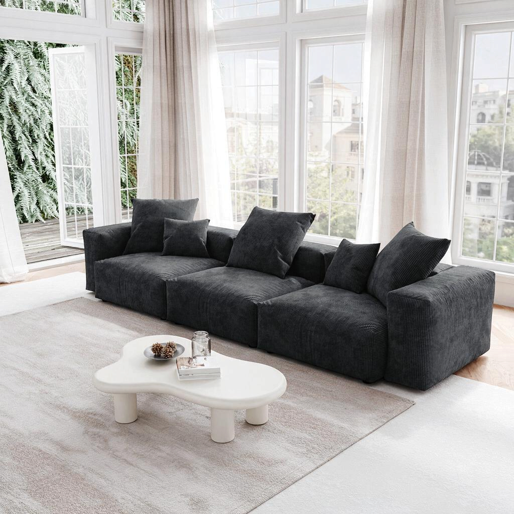 Sofa modulaire Nola 3 morceaux en velours côtelé gris foncé par TOCO Meubles dans un salon lumineux