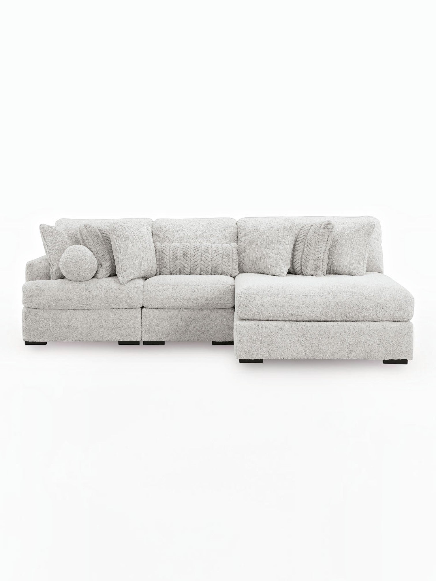 TOCO Meubles Sofa Modulaire Nuage gris clair en tissu texturé avec coussins assortis et un coussin rond.