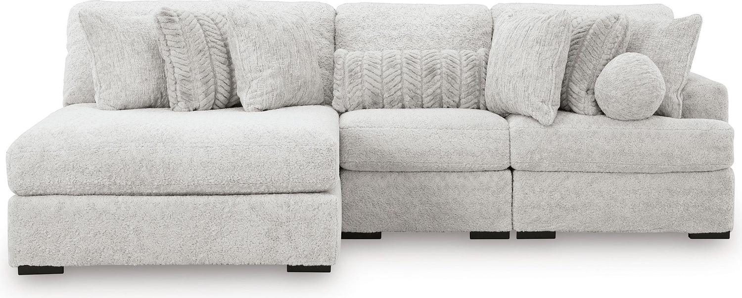 TOCO Meubles Sofa modulaire Nuage gris clair en tissu texturé, avec chaise longue et coussins assortis.